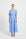 Woman wearing a light blue V-neckline button-through midi dress with elbow-length puffed sleeves.