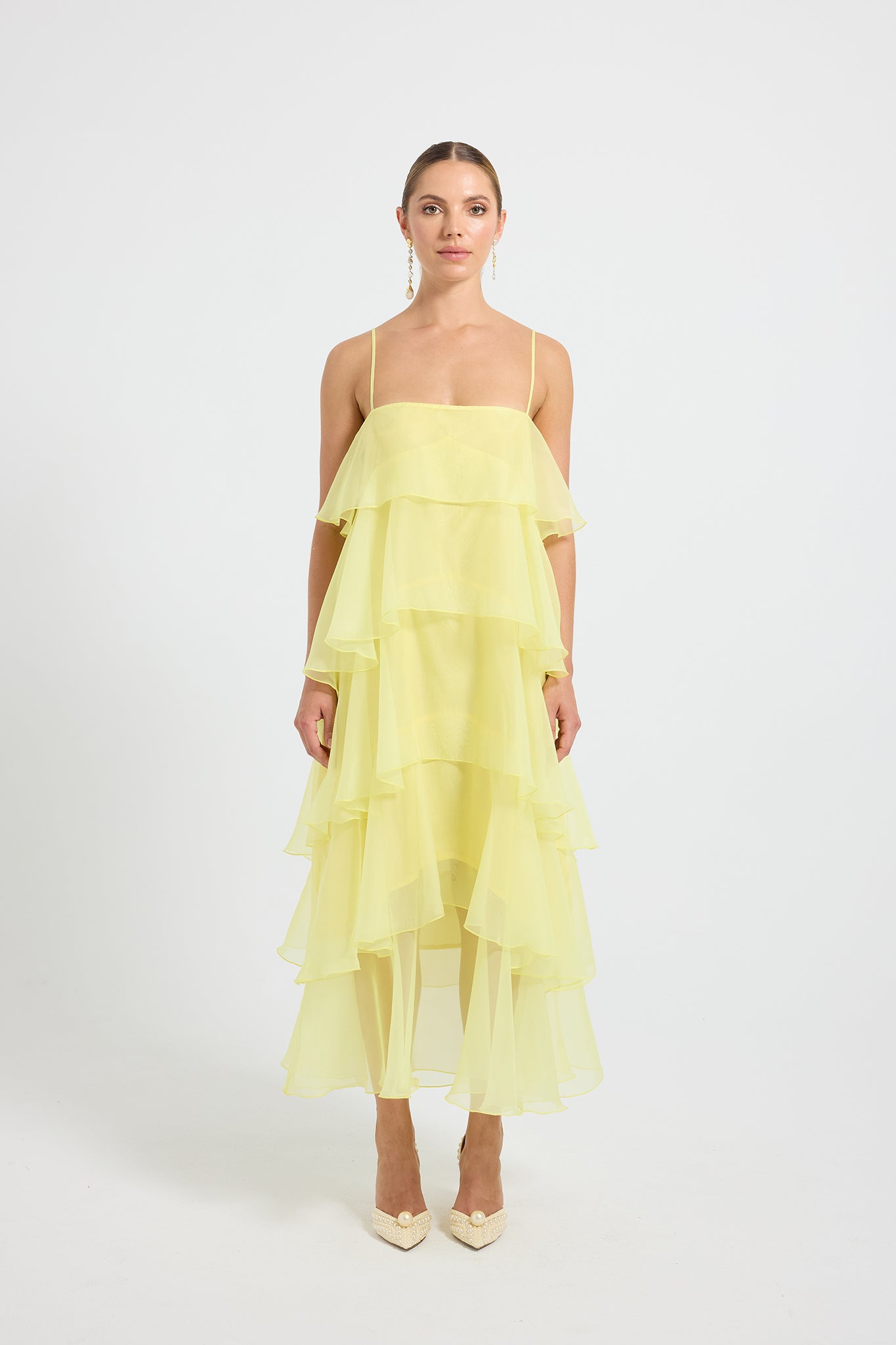 Woman wearing a yellow tiered Maxi Dress 
